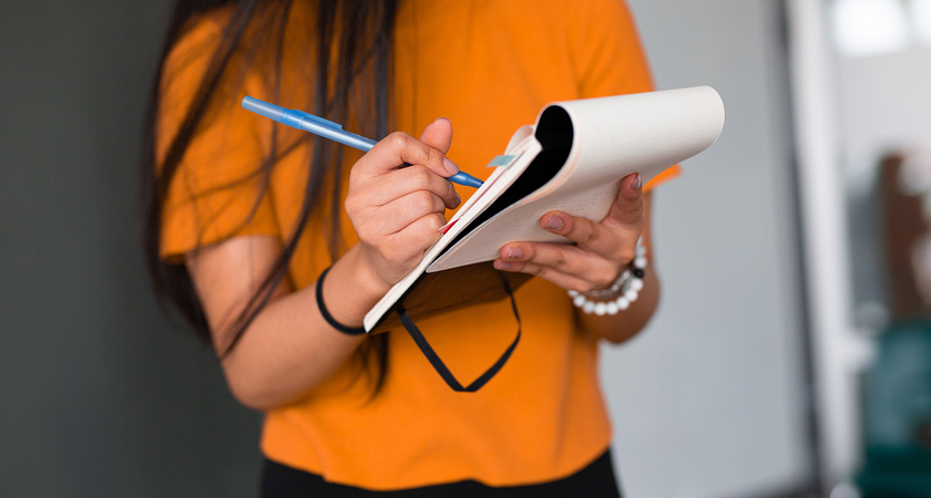 picture of a centennial college student wearing an orange shirt
